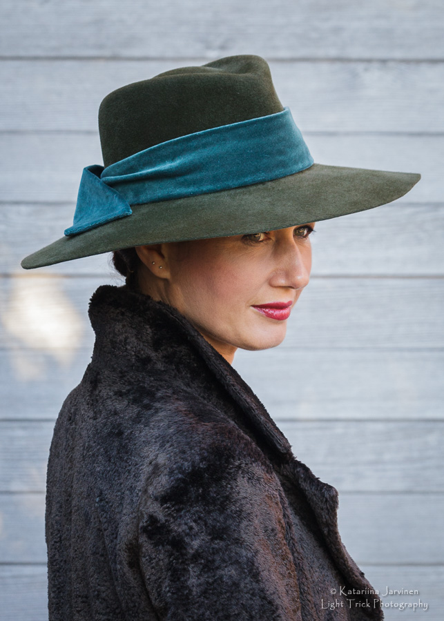 green hat with teal ribbon